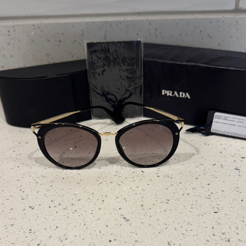 Prada Elegant Black and Gold Cateye/Aviator Style Sunglasses